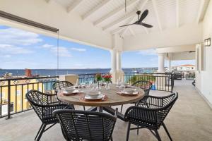 a table and chairs on a patio with a view at Hausmann Penthouse with Stunning Sea View in Kralendijk