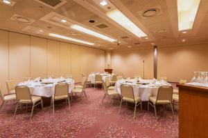 a conference room with tables and chairs in it at Hotel Resol Hakodate in Hakodate