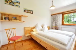 A bed or beds in a room at Schmiedhof