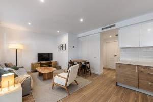 a living room with a couch and a table at Waou Best IV Madrid Rio in Madrid