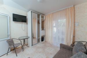 a living room with a couch and a table at Aura in Zatoka