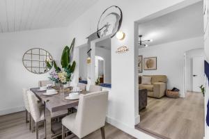 a dining room and living room with a table and chairs at Luxury Miami Home Next to Wynwood & Downtown in Miami +31 photos