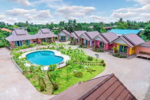 an aerial view of a house with a swimming pool at Samrong Garden in Udon Thani
