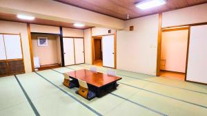 a large room with a wooden table and chairs at LiVEMAX Resort Echigo Yuzawa in Yuzawa
