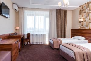 Postel nebo postele na pokoji v ubytování Zagrava Hotel