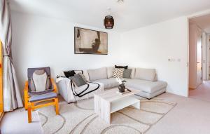 a living room with a couch and a table at Perfect Booking 3 BR Home in Chatham with Parking in Chatham