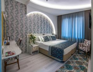 Postel nebo postele na pokoji v ubytování Dündar Hotel