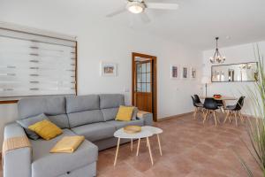a living room with a couch and a table at Villa Nitho in Playa Blanca