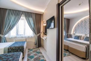 Postel nebo postele na pokoji v ubytování Dündar Hotel + 37 fotografií