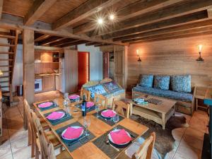 a living room with a table and a couch at Chalet en bois avec 3 chambres à Pra Loup - FR-1-165A-47 in Uvernet-Fours