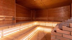 an empty sauna with a light in the middle at LiVEMAX Resort Echigo Yuzawa in Yuzawa