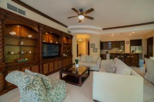 a living room with two couches and a tv at Bella Vista 3F 3 bdr beach club view in Los Suenos in Herradura