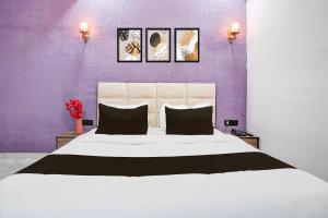 Ένα ή περισσότερα κρεβάτια σε δωμάτιο στο Collection O Shandilya Grand Residency