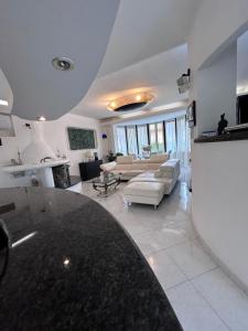 a large living room with a couch and a table at Villa Pina b&b in Colleferro