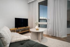 Μια τηλεόραση ή/και κέντρο ψυχαγωγίας στο Lumo Penthouse Hosted by Hygge Host +12 φωτογραφίες