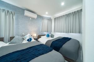 a hotel room with two beds and a window at 別邸Zen小岩 Bettei Zen Koiwa in Tokyo +28 photos