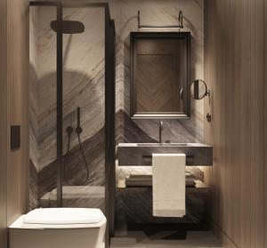 a bathroom with a toilet and a sink and a mirror at Chalet Valdotain in Breuil-Cervinia +8 photos