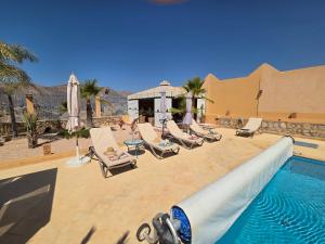 a pool with a water slide in a resort at Havre de paix - Appartement avec piscine in Elma