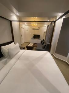 Ένα ή περισσότερα κρεβάτια σε δωμάτιο στο Tivai Beach Hotel