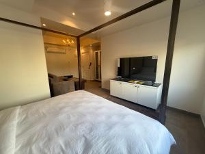 Μια τηλεόραση ή/και κέντρο ψυχαγωγίας στο Tivai Beach Hotel