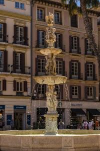 a water fountain in front of a building at NOMADIA en LARIOS STREET in Málaga