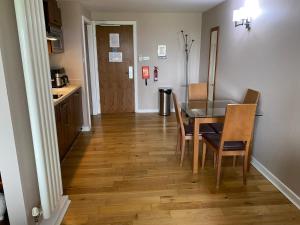 a kitchen and dining room with a table and chairs at Fell View in Troutbeck