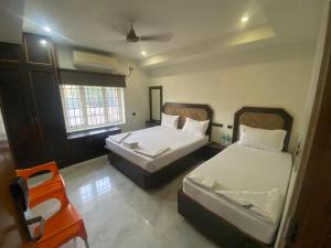 Postel nebo postele na pokoji v ubytování Hotel Srees
