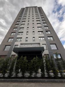 a tall building with a sign on it at One way in Kayseri