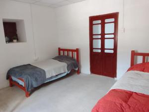 Voodi või voodid majutusasutuse Caraz - Cozy Cottage toas