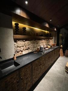 a kitchen with a long counter in a room at year after year in Lijiang