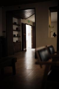 a room with a hallway with a door and a wooden floor at year after year in Lijiang