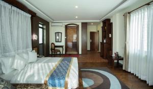 Uma área de estar em Dahlia Boutique Hotel