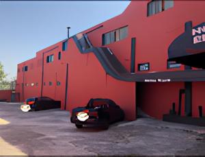 a red building with two cars parked in a parking lot at Hotel Ellos - Estacionamento e Café da Manhã Incluso in Itaquaquecetuba