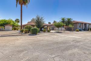 an empty parking lot in front of a building at Quiet and Convenient! Condo with Balcony Near ASU in Tempe Royal Palms