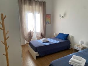 Ένα ή περισσότερα κρεβάτια σε δωμάτιο στο EMMEVI House