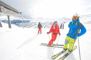 a group of people on skis in the snow at Skarsnuten Panorama 61, Hemsedal in Hemsedal