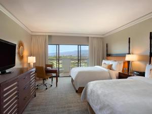 Ένα ή περισσότερα κρεβάτια σε δωμάτιο στο Fairmont Orchid