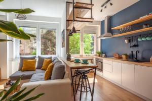 a living room with a couch and a table at K24 - Old Town Luxury Apt in Bratislava