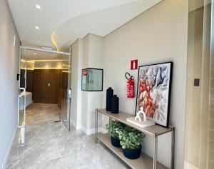 TV a/nebo společenská místnost v ubytování Ap 205 Central Wi-Fi, Vista e Auto Check-in
