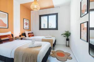 a hotel room with two beds and a window at Vervana 2-Bedroom Apartment in Larnaca