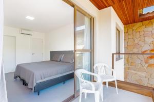 Ένα ή περισσότερα κρεβάτια σε δωμάτιο στο GB126 Maravilhoso Village com 4 suítes - Guarajuba +40 φωτογραφίες