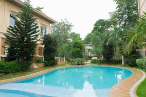 a swimming pool in front of a building at N Residences in Puerto Princesa City