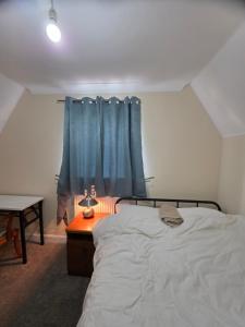 Ένα ή περισσότερα κρεβάτια σε δωμάτιο στο Colchester Comfortable room y4