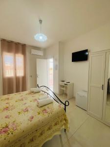 TV a/nebo společenská místnost v ubytování Blu Marzamemi Rooms