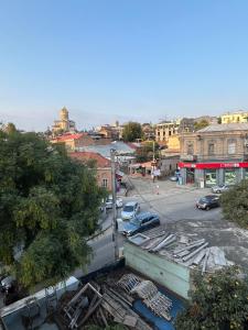 a view of a city with cars parked in a parking lot at GuestHouse Old Avlabari in Tbilisi City +54 photos