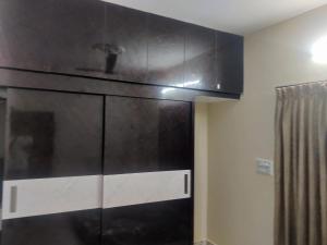 a black and white cabinet in a room at Zenobia House in Udupi