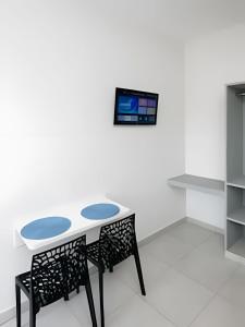 TV a/nebo společenská místnost v ubytování Xavi Studio