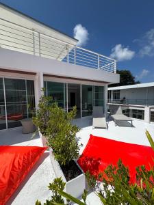 a house with a red blanket on a patio at Villa Rooftop in Ban Saiyuan (1)