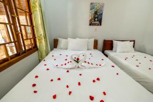 Ένα ή περισσότερα κρεβάτια σε δωμάτιο στο Minh Vuong Bungalow