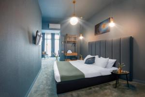 a bedroom with a large bed in a room at HB Freeze Inn in Tbilisi City